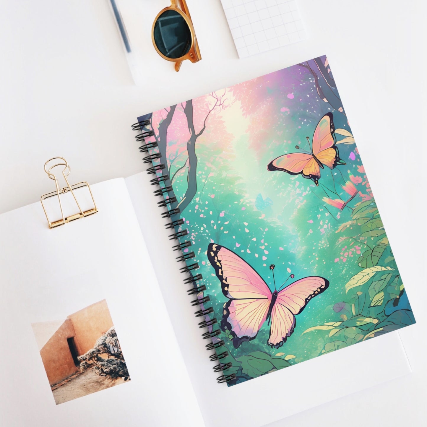 Notebook with butterfly design on a white surface