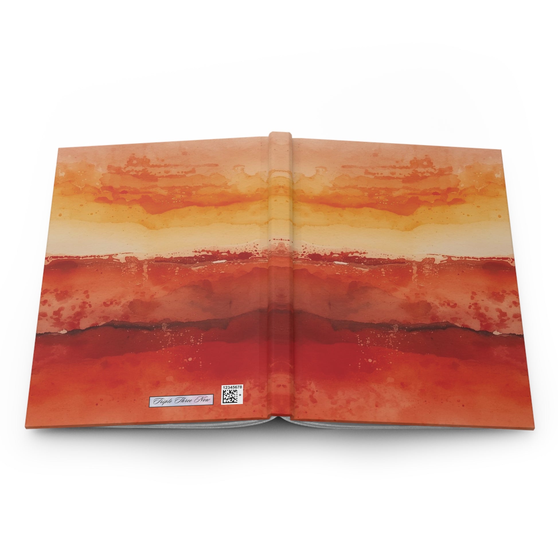 Open book with watercolor-style abstract design on a white background