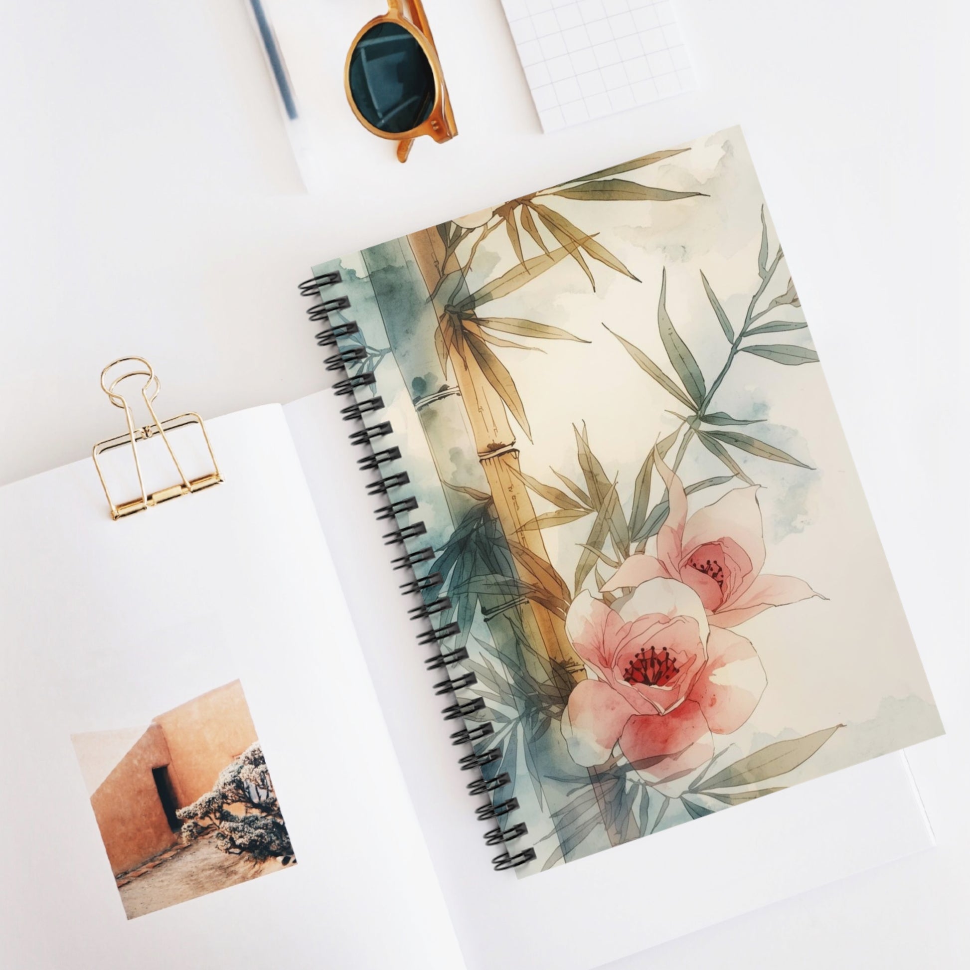 Notebook with floral design on a white surface