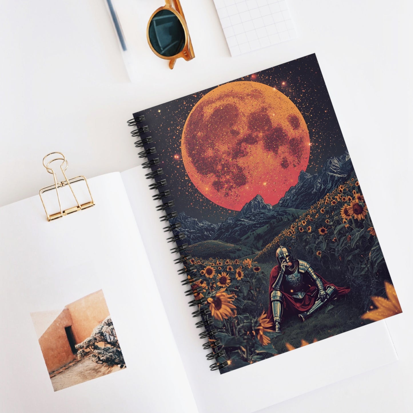 Notebook with celestial design on a white surface
