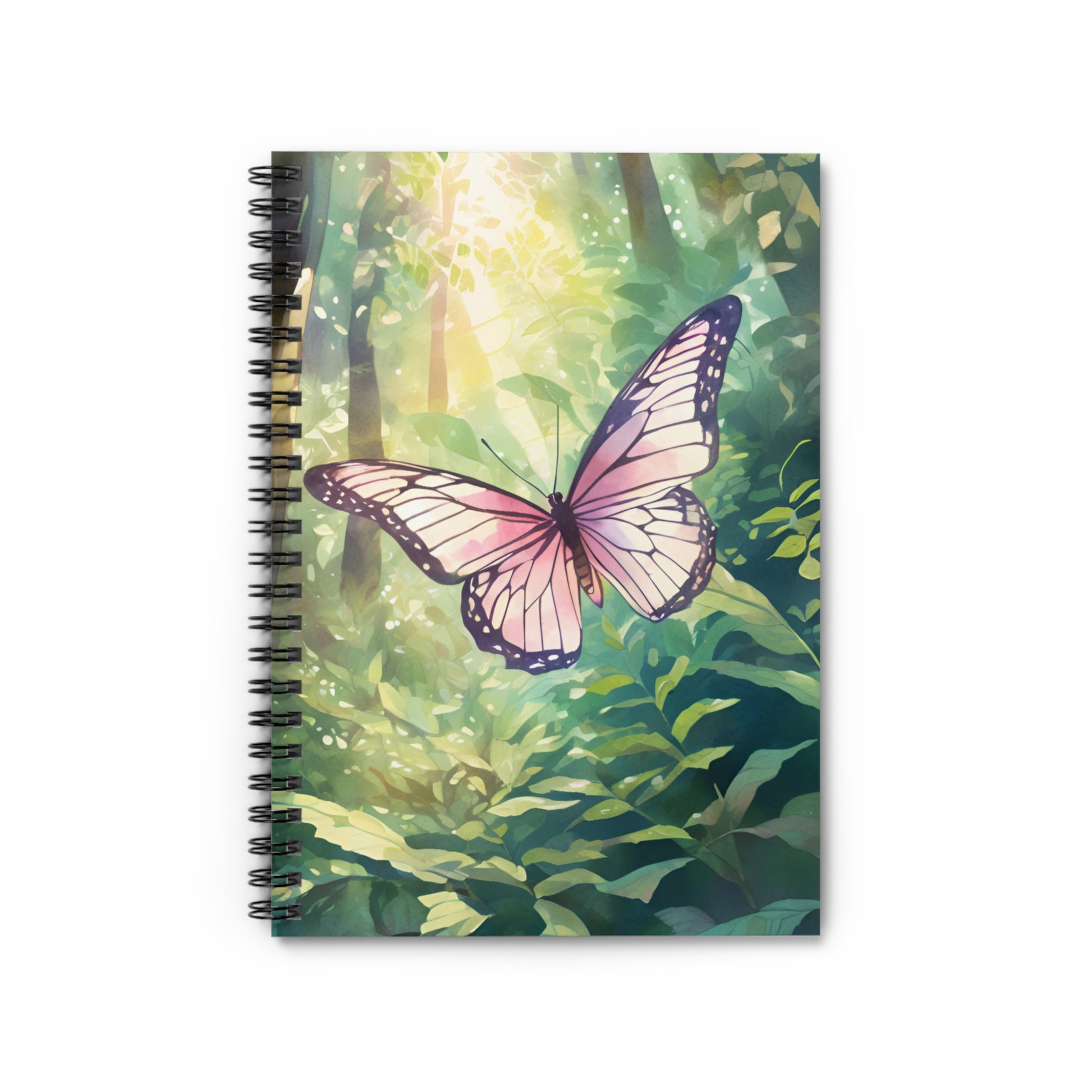 Notebook with a butterfly design on a green forest background