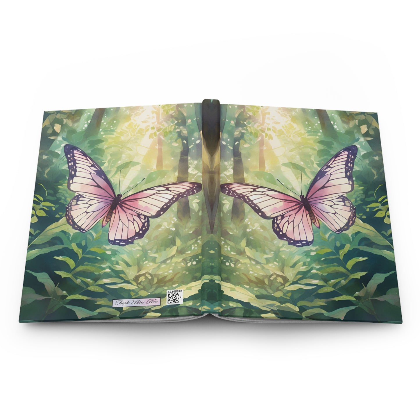 Book with a cover featuring two pink butterflies and a forest design.