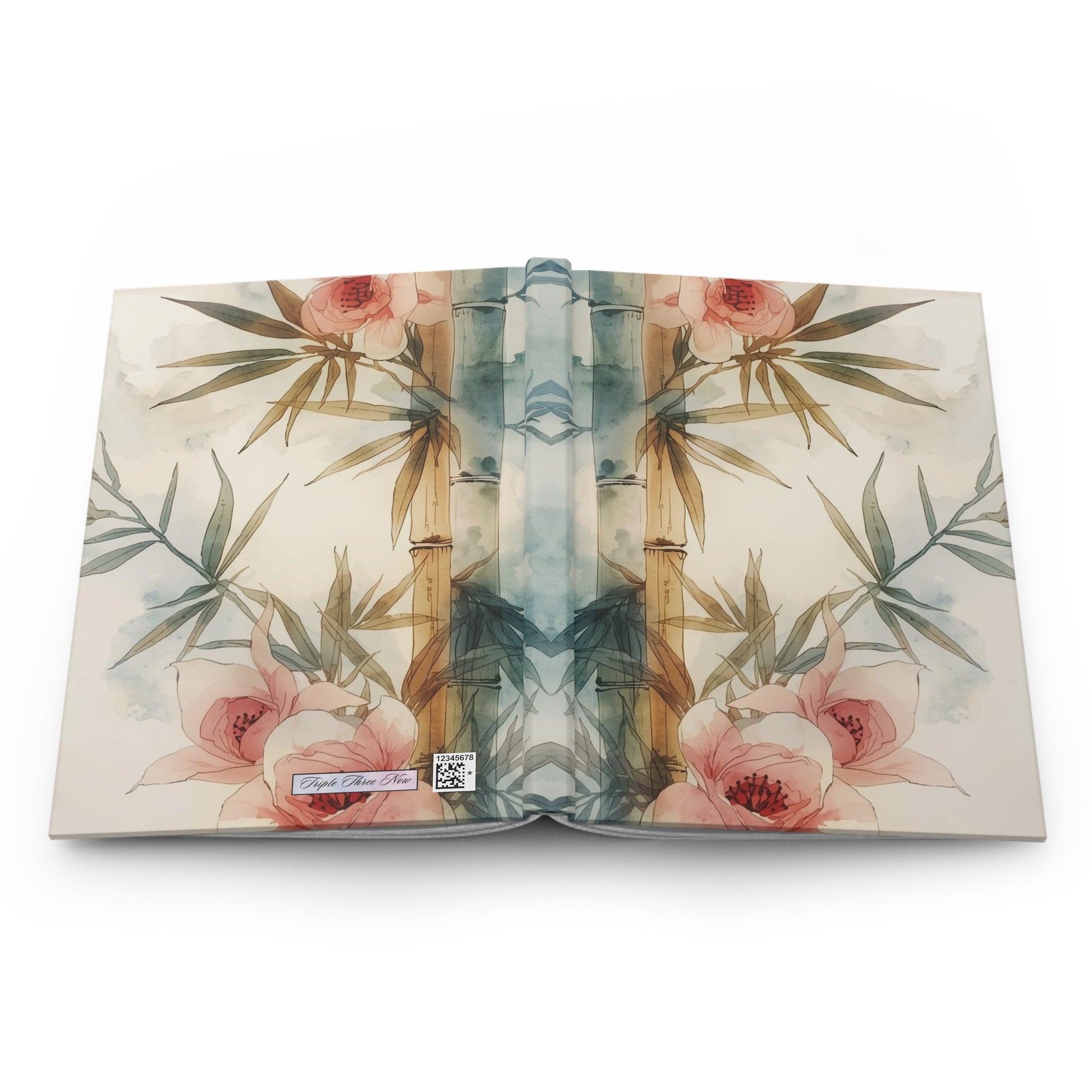 Open book with floral and bamboo design on a white background