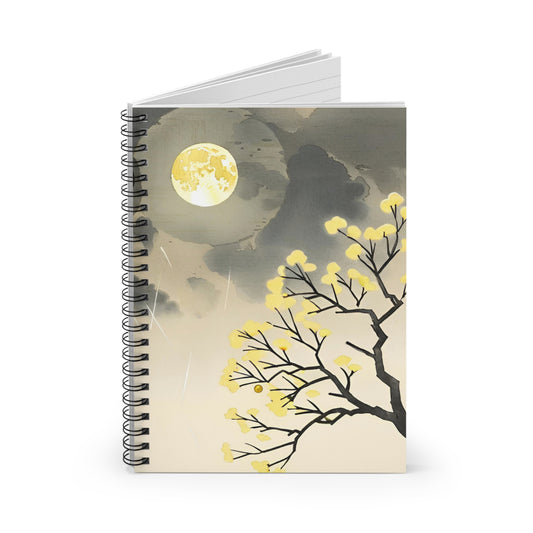 Notebook with a design of a full moon and tree branches on the cover