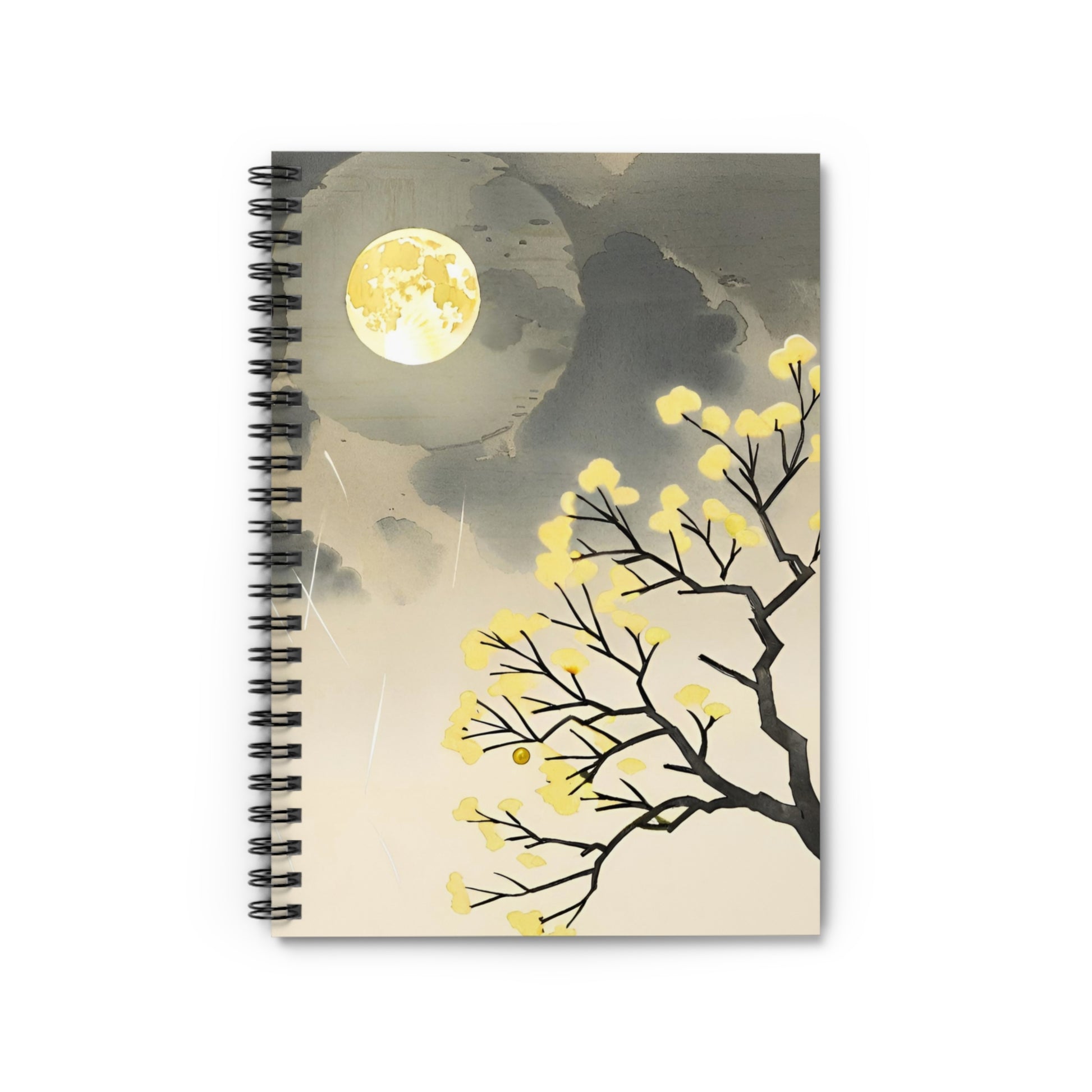 Notebook with a design of a tree, moon, and silhouette against a cloudy sky.