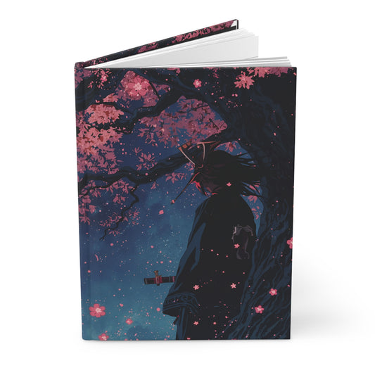 Notebook with cherry blossom design and silhouette of a samurai person under a tree