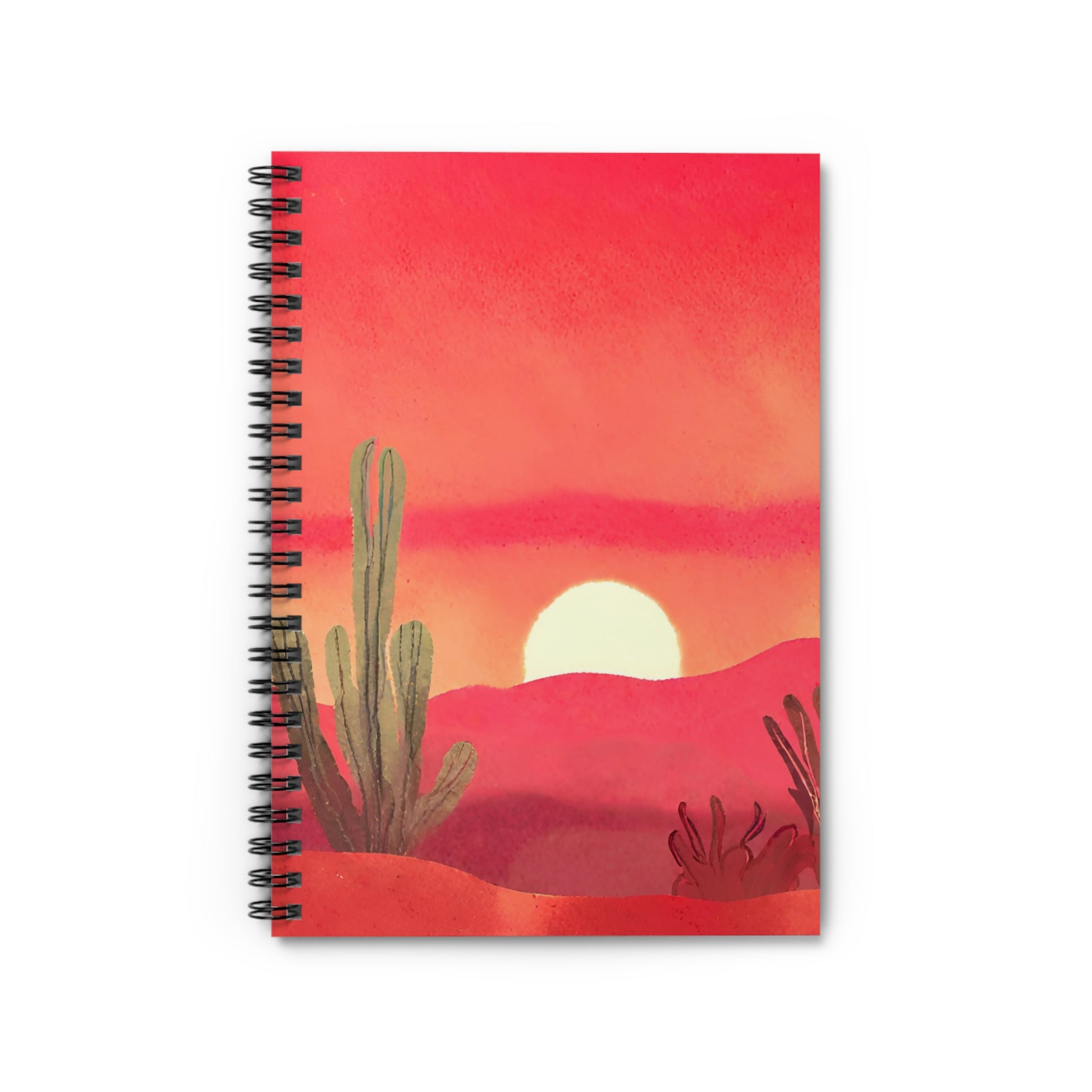 Notebook with a desert sunset design on the cover