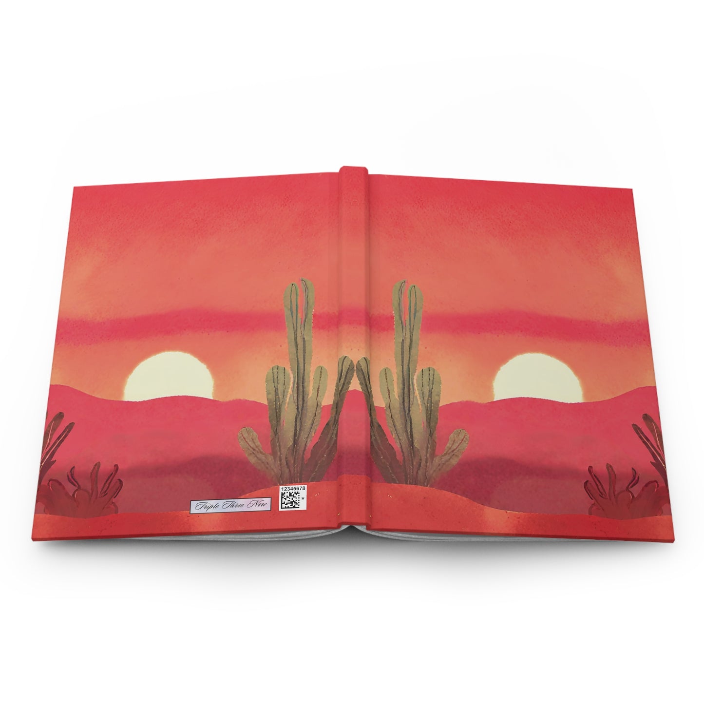 Open book with a desert landscape illustration featuring cacti and a sunset.
