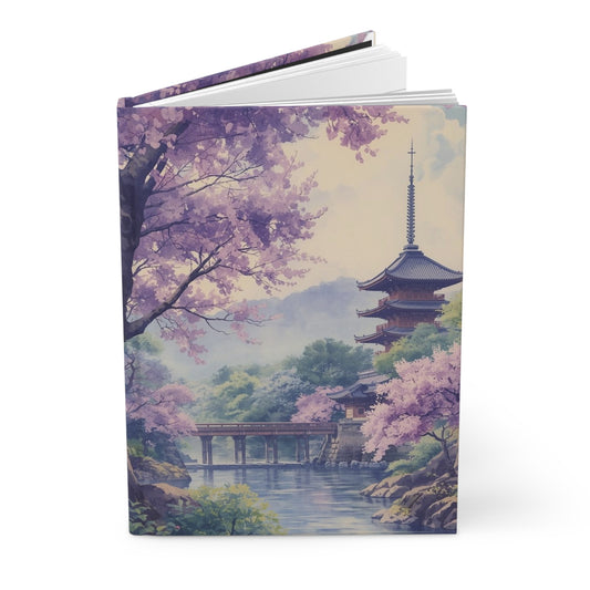 Notebook with cherry blossom and pagoda design on a white background
